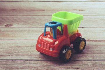 Kid's toy dump truck isolated on white	
