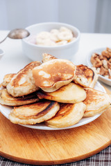 Pancakes with banana porridge for breakfast. A stack of pancakes. Milk porridge with banana.