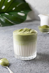 Dalgona Iced Matcha tea. Whipped white eggs with matcha tea is added to milk with ice.
