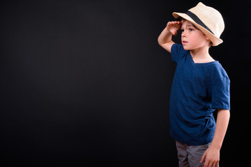 Profile view of young handsome boy as tourist searching something