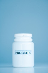white bottle with probiotic lettering on blue