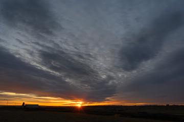  grain terminal silhouetted against a brilliant sunset