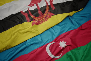 waving colorful flag of azerbaijan and national flag of brunei.