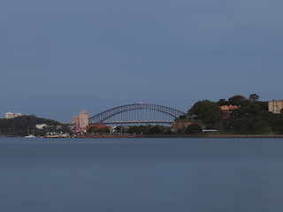 Naklejka premium Drone Panoramic Aerial view of Sydney Harbour and the beautiful vibrant colours of the afternoon showing smooth harbour waters 