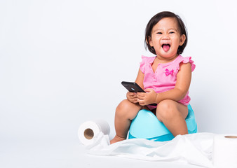 cute baby child girl education training to sitting on blue chamber pot