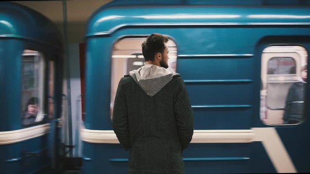 man waiting for his train in the subway