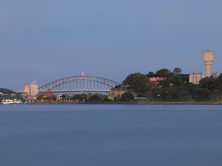Naklejka premium Drone Panoramic Aerial view of Sydney Harbour and the beautiful vibrant colours of the afternoon showing smooth harbour waters 