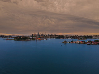 Naklejka premium Drone Panoramic Aerial view of Sydney Harbour and the beautiful vibrant colours of the afternoon showing smooth harbour waters 