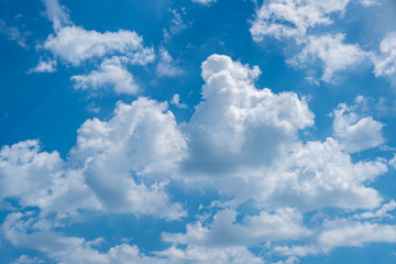 Naklejka na ściany i meble Blue sky background with white clouds, texture