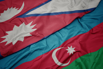 waving colorful flag of azerbaijan and national flag of nepal.