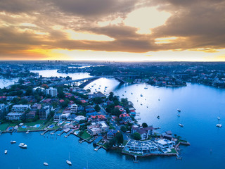 Naklejka premium Drone Panoramic Aerial view of Sydney Harbour and the beautiful vibrant colours of the afternoon showing smooth harbour waters 