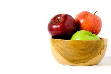 Group of green and red Apple fruit on a wooden bowl / basket isolated on white background