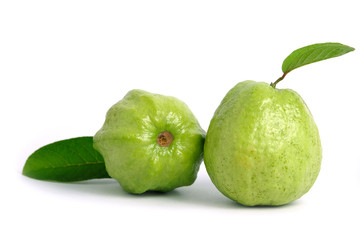Two green crystal guava fruit with leaves isolated on white background