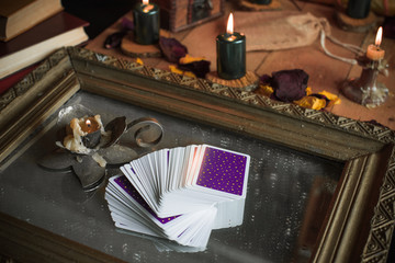 Tarot cards and esoteric concept. Magic rituals. Mystical table with details, 