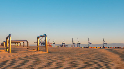 Stogi beach and deep water terminal (DCT Gdansk, Poland. Container facility). - obrazy, fototapety, plakaty