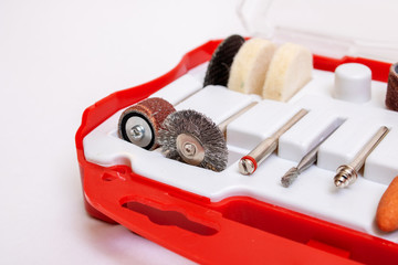 Set of nozzles for engraver in plastic box on white background