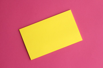 Obraz na płótnie Canvas Yellow sticky note. Pink background.