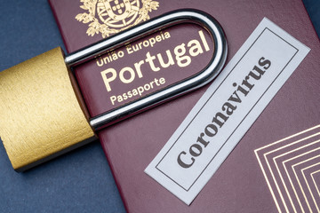 Portuguese european travel passport with padlock on blue background. Close-up. European Union