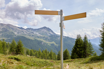 High way signpost on the background of nature, forest and mountains. Beautiful landscape.
