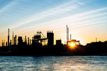 Sunset behind a chemical plant in Germany