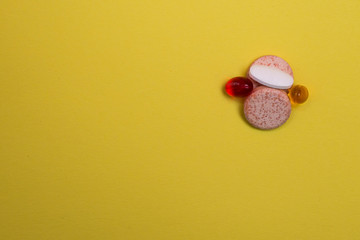 Assorted medicine pills, pharmaceutical vitamin C on yellow background 1