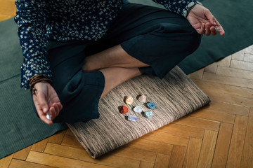 Meditating with Crystals Lotus Pose.  Quartz Crystal Chakra Wand in Hands
