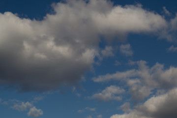 Fototapeta premium sky, clouds, cloud, blue, nature, white, weather, cloudy, day, cloudscape, air, atmosphere, heaven, sun, space, abstract, storm, light, summer, blue sky, skies, fluffy, outdoors, cumulus, dramatic