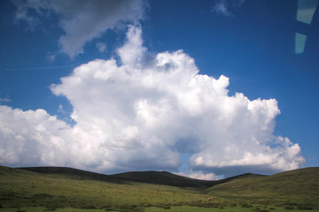 Fototapeta na wymiar clouds in the mountains Siberia