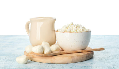 Different dairy products on table against white background