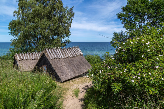 View of Kn&auml;b&auml;ckshusens Chapel on a sunny summer day with the blue waters of the Baltic Sea in the background.