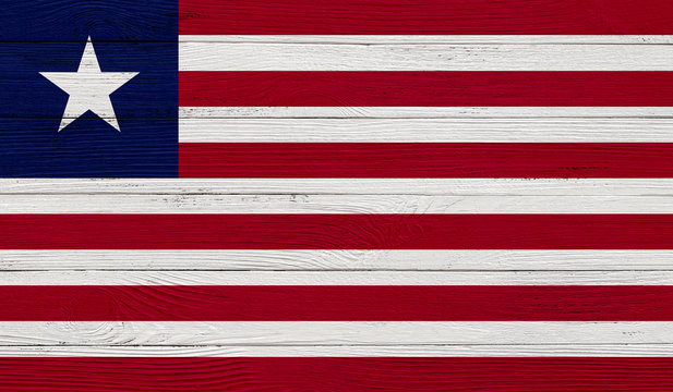 Liberia flag on a wooden texture. Wood texture, planks Wooden texture background flag. Flag painted with paints on wood