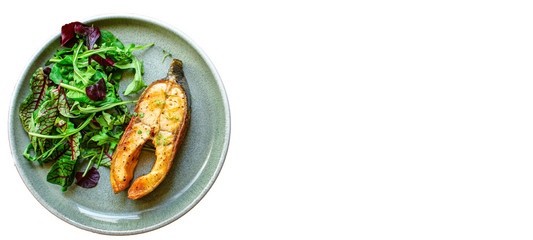pink salmon steak fried and salad,
grilled seafood, pescatarian Menu concept food background keto or paleo diet. top view. copy space for text