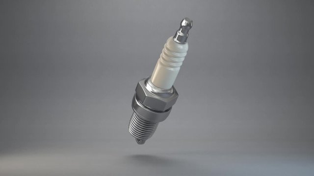 plug spark rotate on a grey