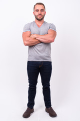 Full body shot of muscular bearded man