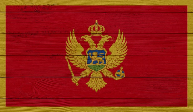 Montenegro flag on a wooden texture. Wood texture, planks Wooden texture background flag. Flag painted with paints on wood