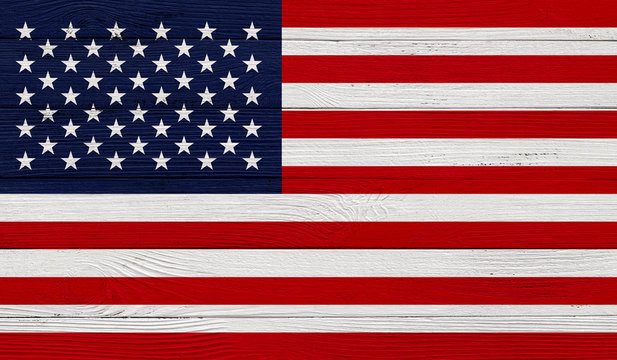 USA flag on a wooden texture. Wood texture, planks Wooden texture background flag. Flag painted with paints on wood
