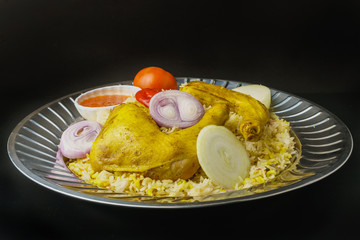 arabic chicken mandi rice on black background