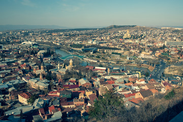 Panorama of the city of Tbilisi from a high point. Tiled roofs of old houses. View of the old city.