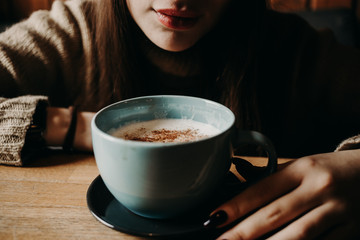 young woman with cup of coffee