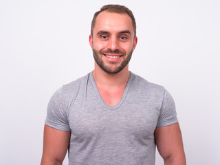 Obraz premium Portrait of happy muscular bearded man smiling