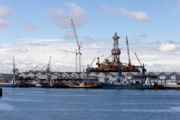 Fototapeta premium fishing boats in harbor, lined up behind each other