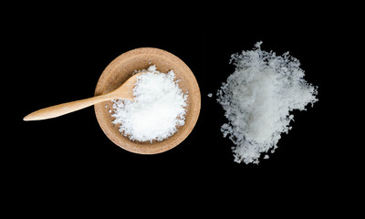  salt on a black background,salt on wooden spoon isolated on white background,A pile of coarse salt on a black background