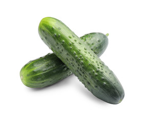 Green cucumbers on white background