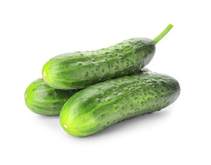 Green cucumbers on white background