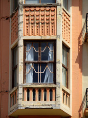 Fototapeta na wymiar Revival architecture in the city of Melilla. Spain. Detail of guillotine window. 