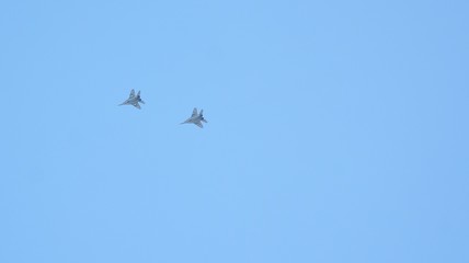 Two fighter jets flying at high altitude