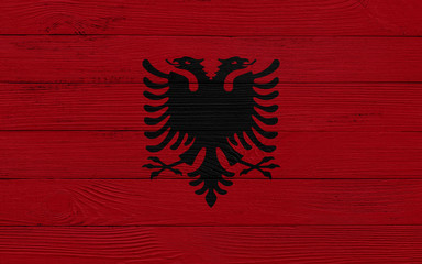 Albania flag on a wooden texture. Wood texture, planks Wooden texture background flag. Flag painted with paints on wood