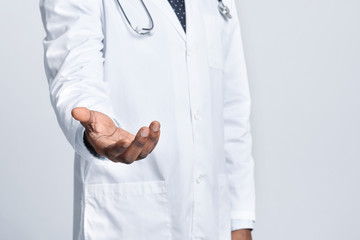 Medical doctor holding something in his hand