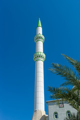 Fototapeta na wymiar The minaret of the main mosque in the town of Side. Anatolian coast. Turkey.