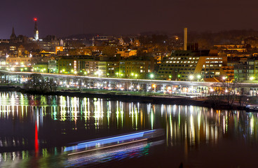 Potomac river with skyline of Georgetown at night with light reflection